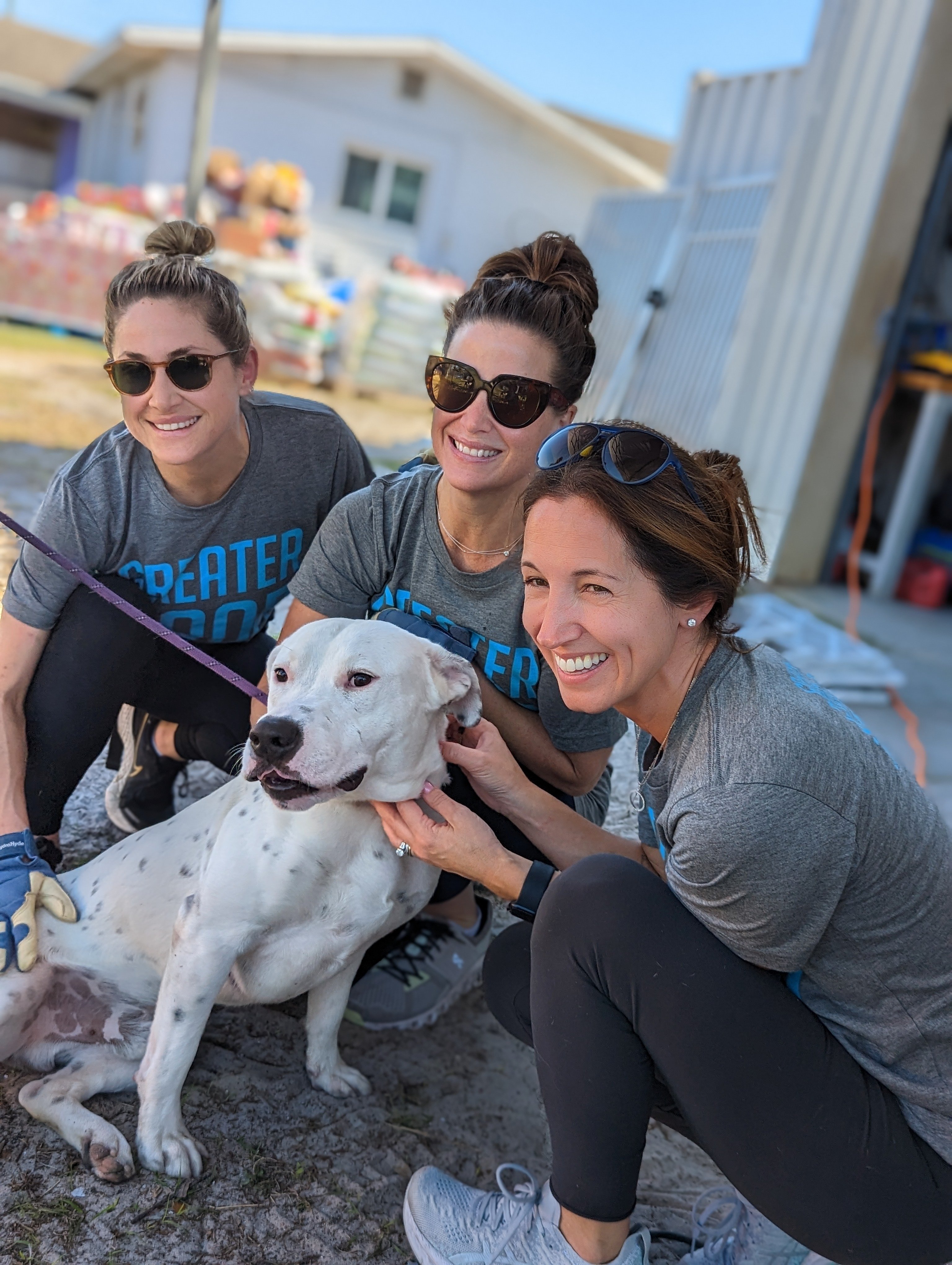 20230206_Volunteers Smiling with Dog_©GGC_Gulf Coast Humane Society_Rescue Rebuild Phase Two